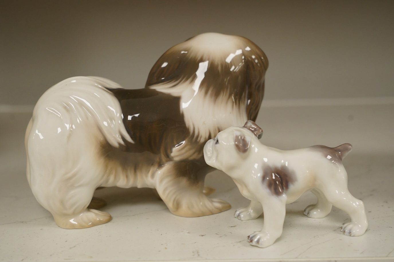 An early Bing & Grondahl figure of a Japanese Chin 12cm high, and a Dahl Jensen small bulldog, 7cm high. Condition - good